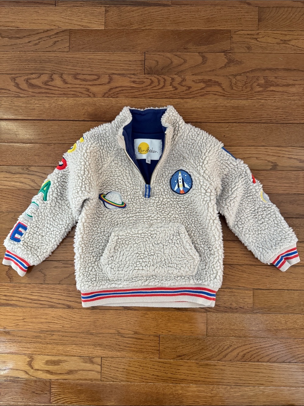 Mini Boden Cream Sherpa Hoodie with Space Patches and Red/Blue Trim